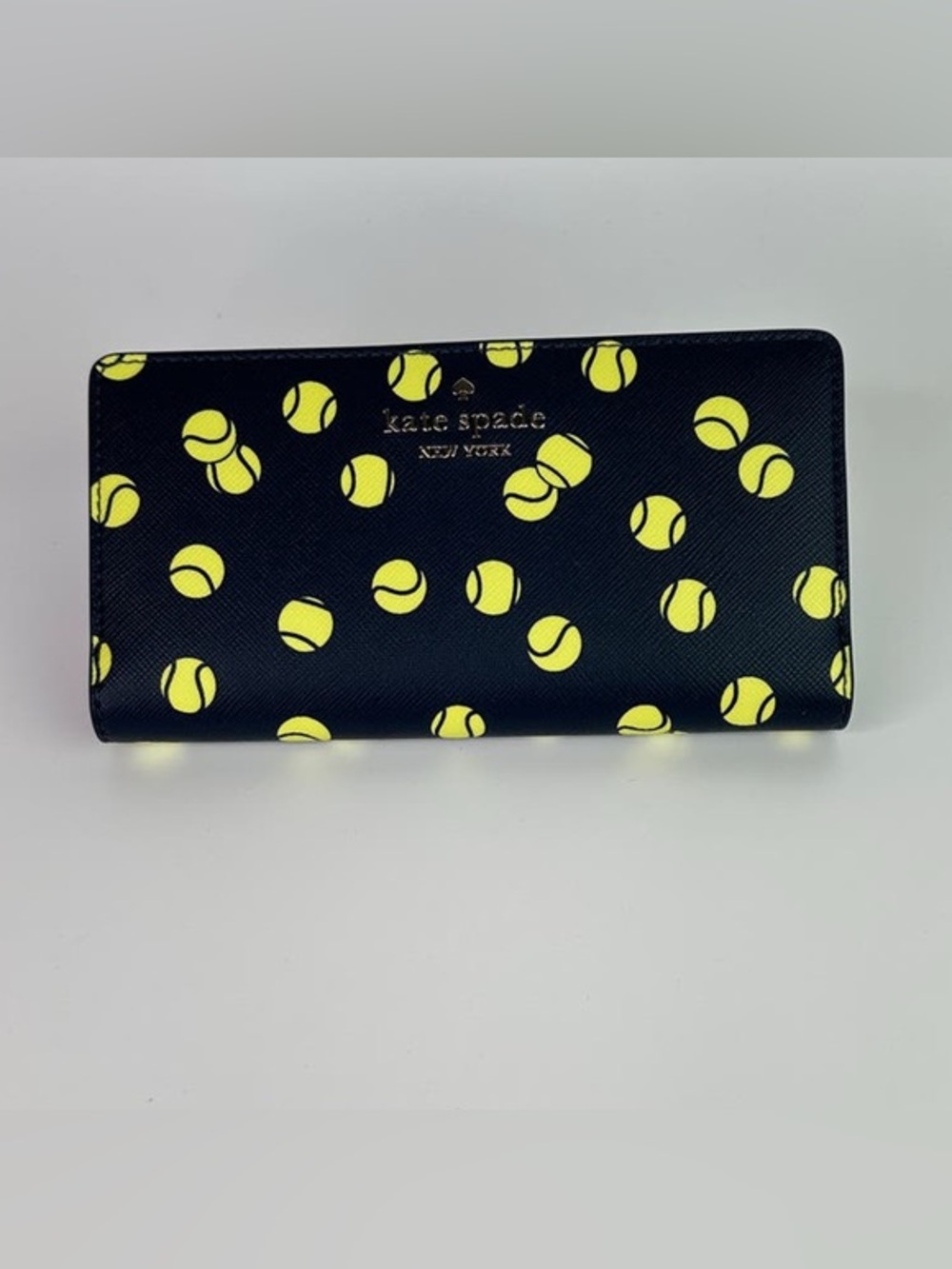 kate spade tennis toss large slim bifold wallet